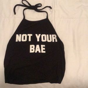 black crop with open back ties at neck